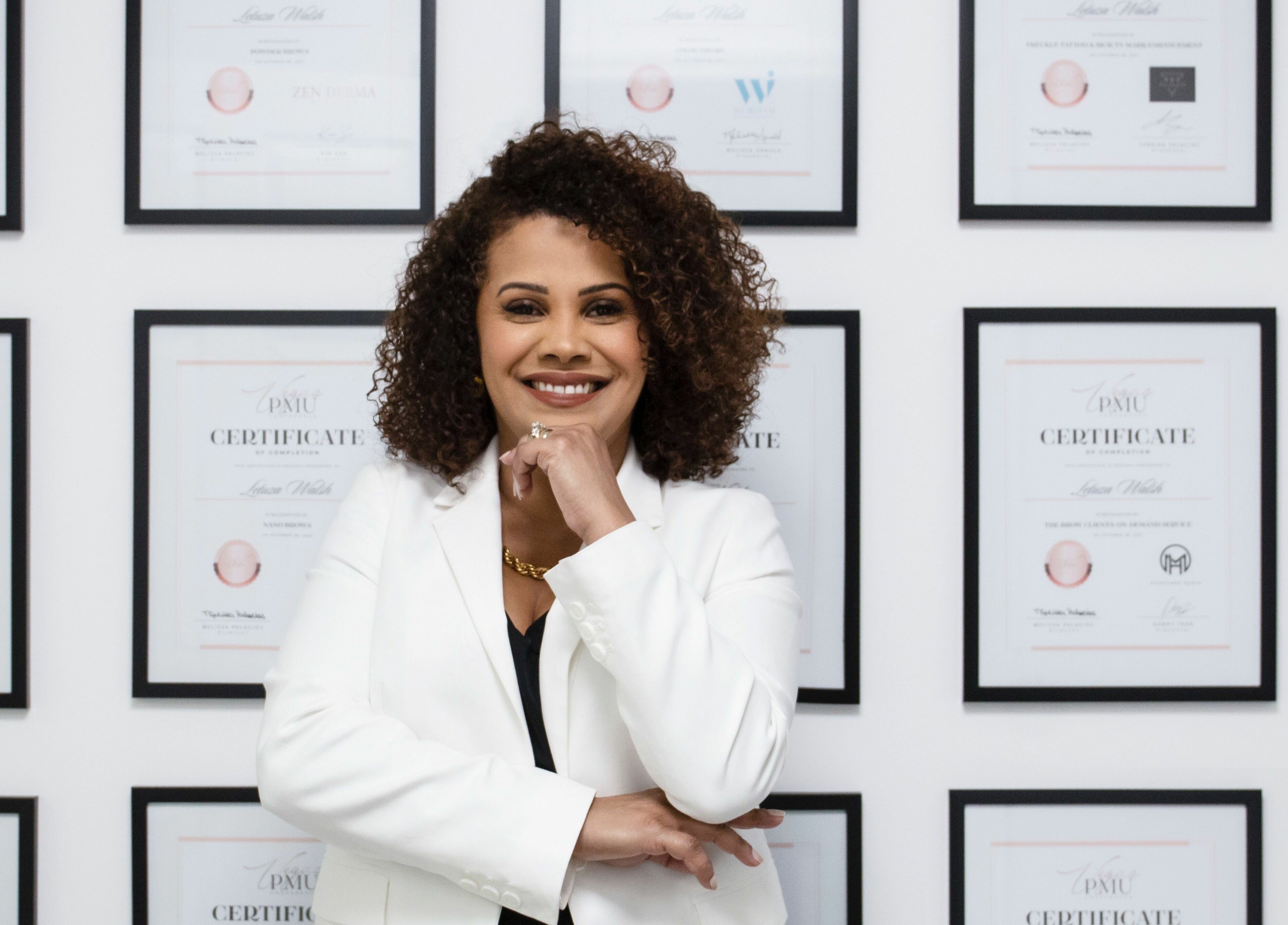 Professional at Shape It Body and Face with framed certificates in Fort Myers, Florida, US.