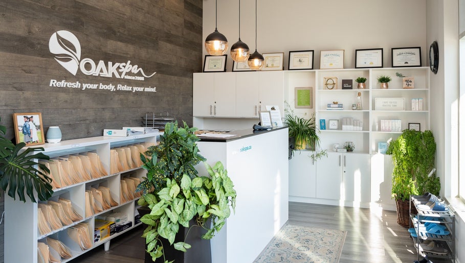 Reception area of Oakspa Wellness Inc., Markham, Ontario, CA, featuring elegant decor and lush plants.