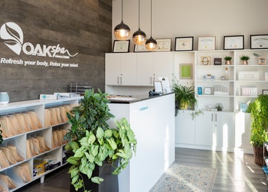 Reception area of Oakspa Wellness Inc., Markham, Ontario, CA, featuring elegant decor and lush plants.