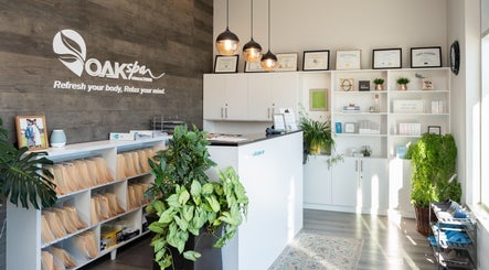 Reception area of Oakspa Wellness Inc., Markham, Ontario, CA, featuring elegant decor and lush plants.