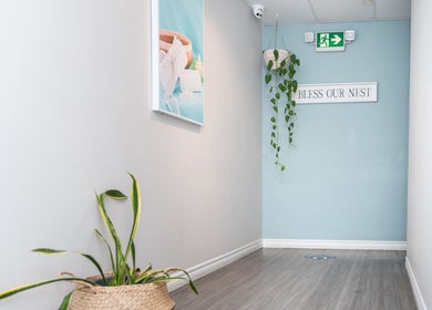 Serene hallway with plants at Oakspa Wellness Inc., Markham, Ontario, CA. Inviting and peaceful ambiance.