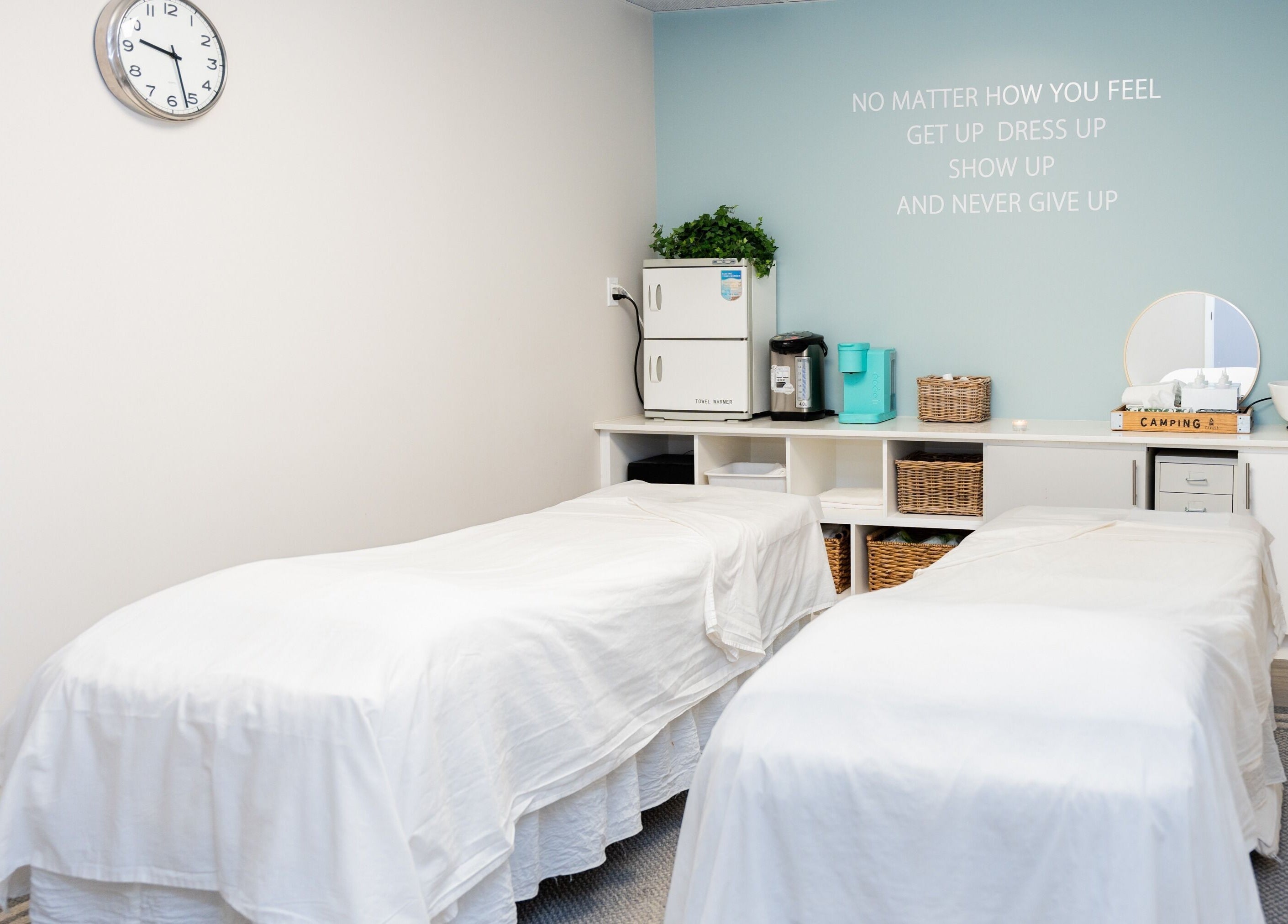 Relaxing massage room at Oakspa Wellness Inc., Markham, Ontario, CA with twin massage tables and calming decor.