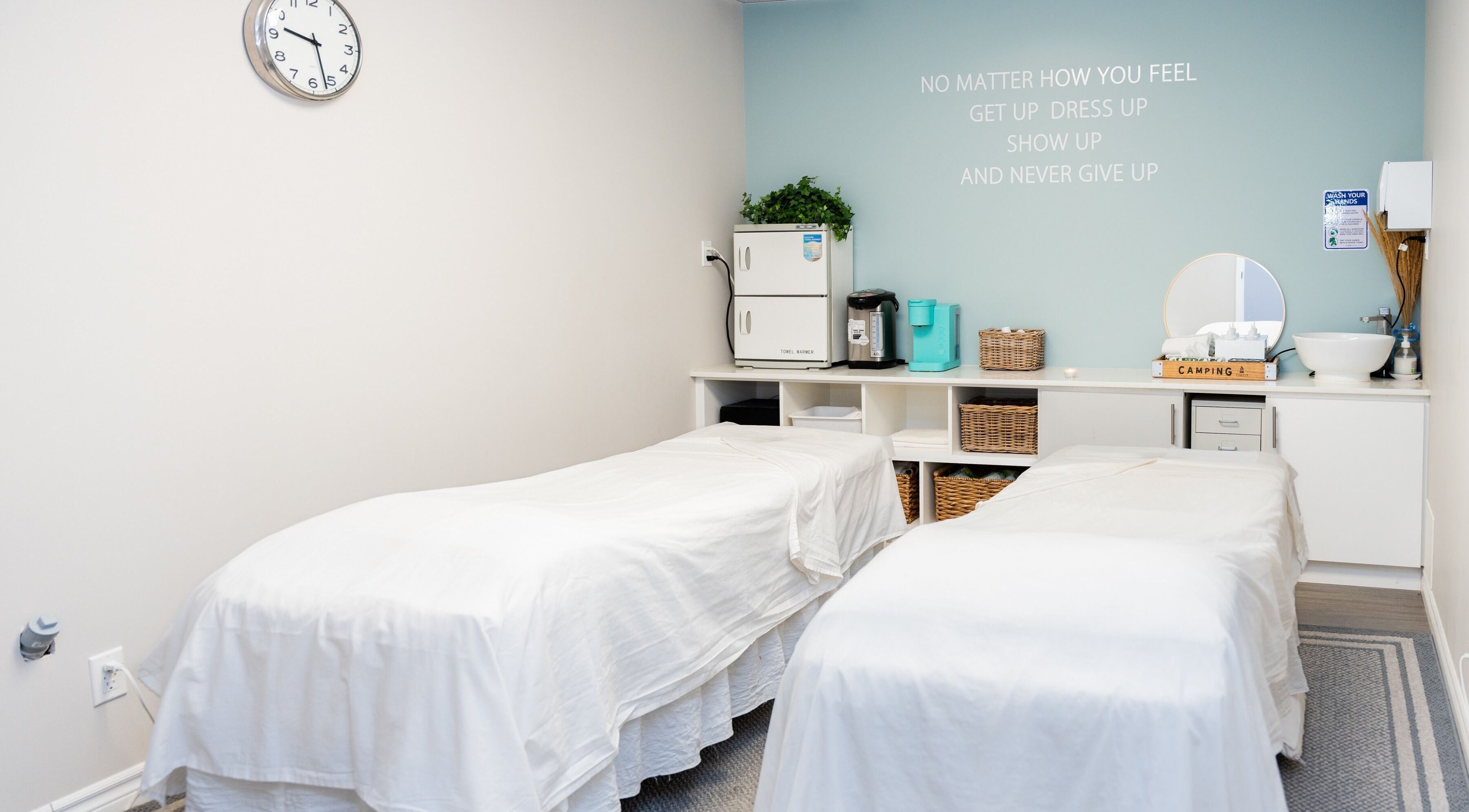 Relaxing massage room at Oakspa Wellness Inc., Markham, Ontario, CA with twin massage tables and calming decor.