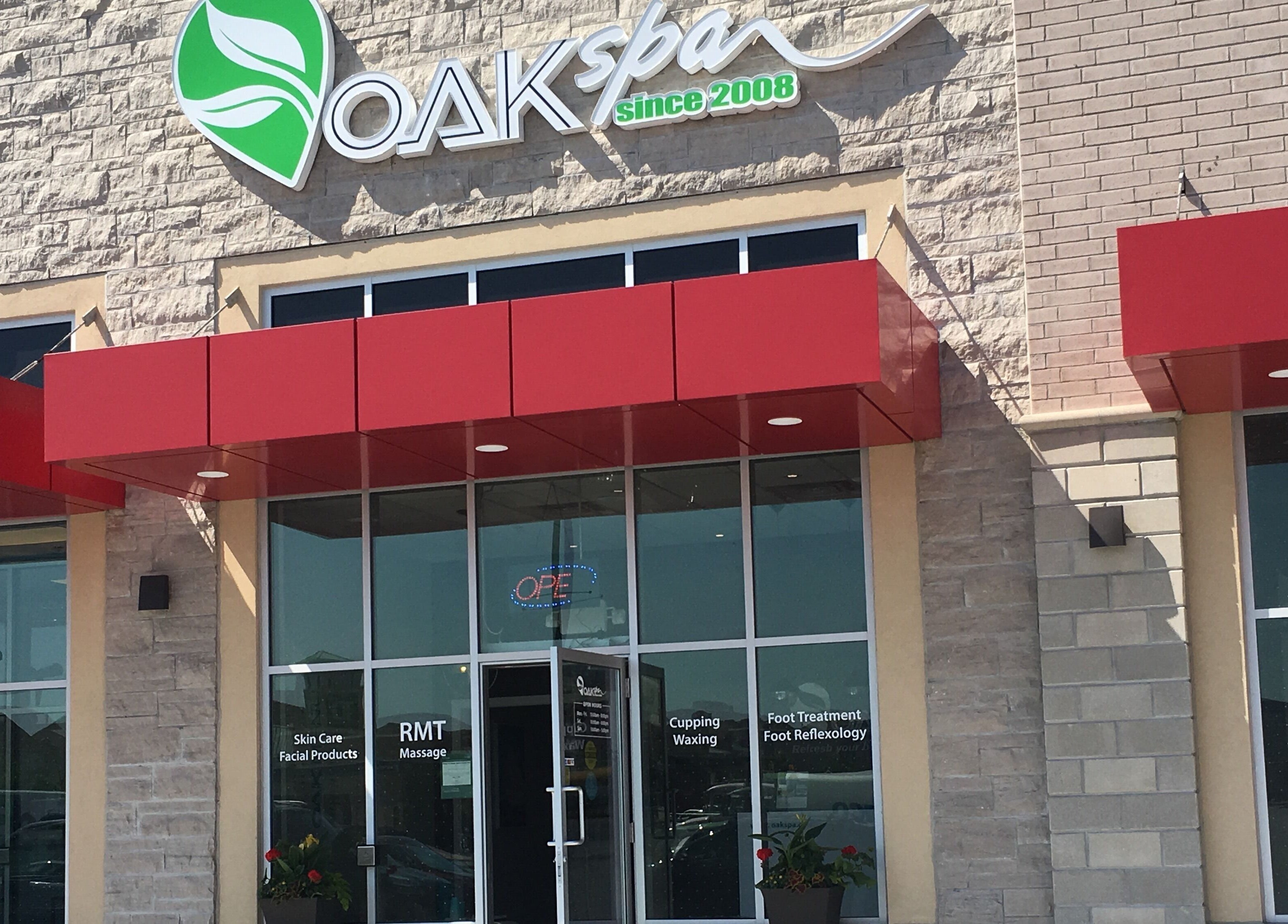 Front entrance of Oakspa Wellness Inc. in Markham, Ontario, CA with welcoming red canopy.