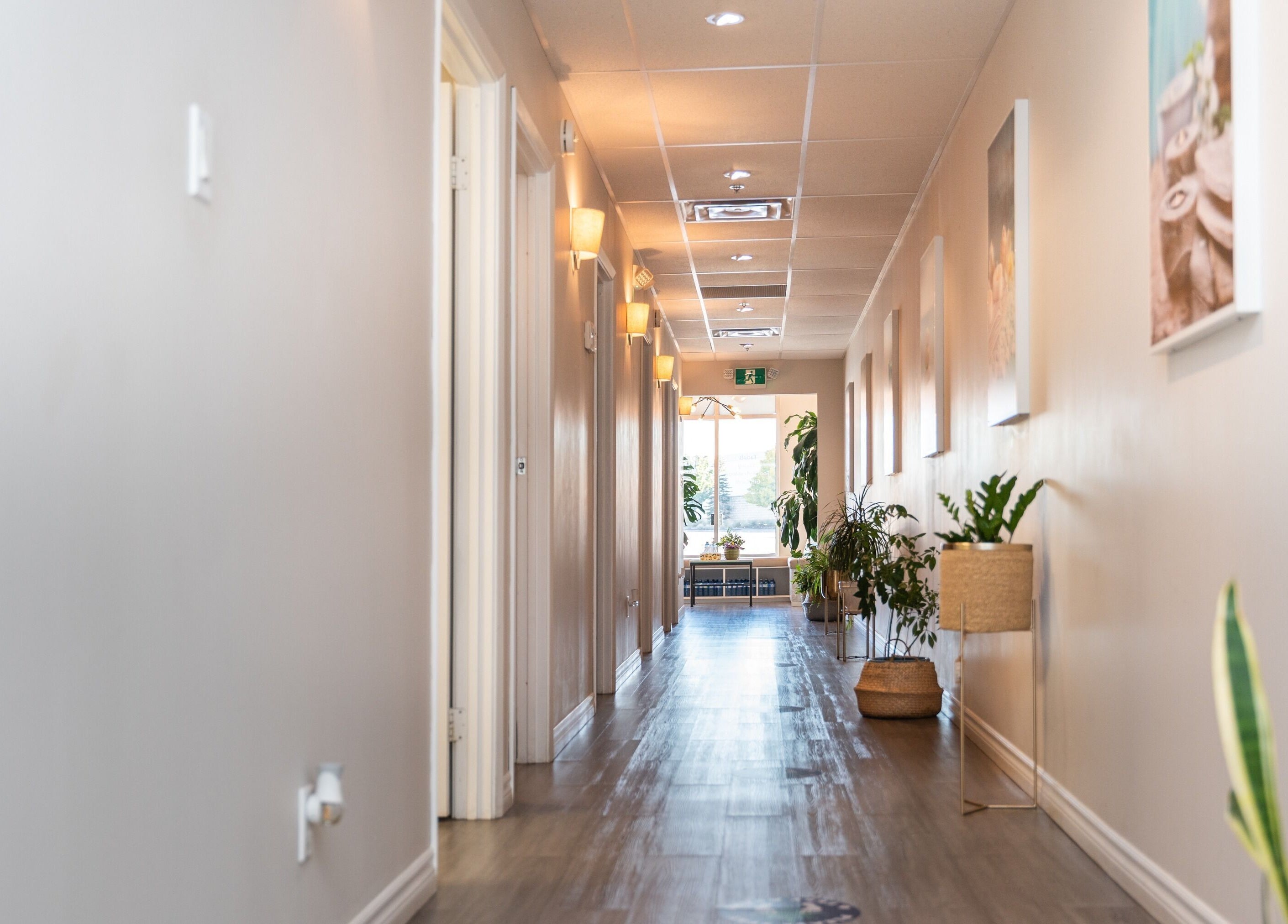 Bright hallway at Oakspa Wellness Inc., Markham, Ontario, CA, with plants and cozy lighting.