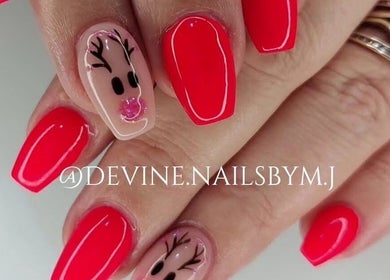 Festive nail art with red polish at Devine Nails by M J, Pretoria, Gauteng, ZA. Perfect for a stylish holiday look.