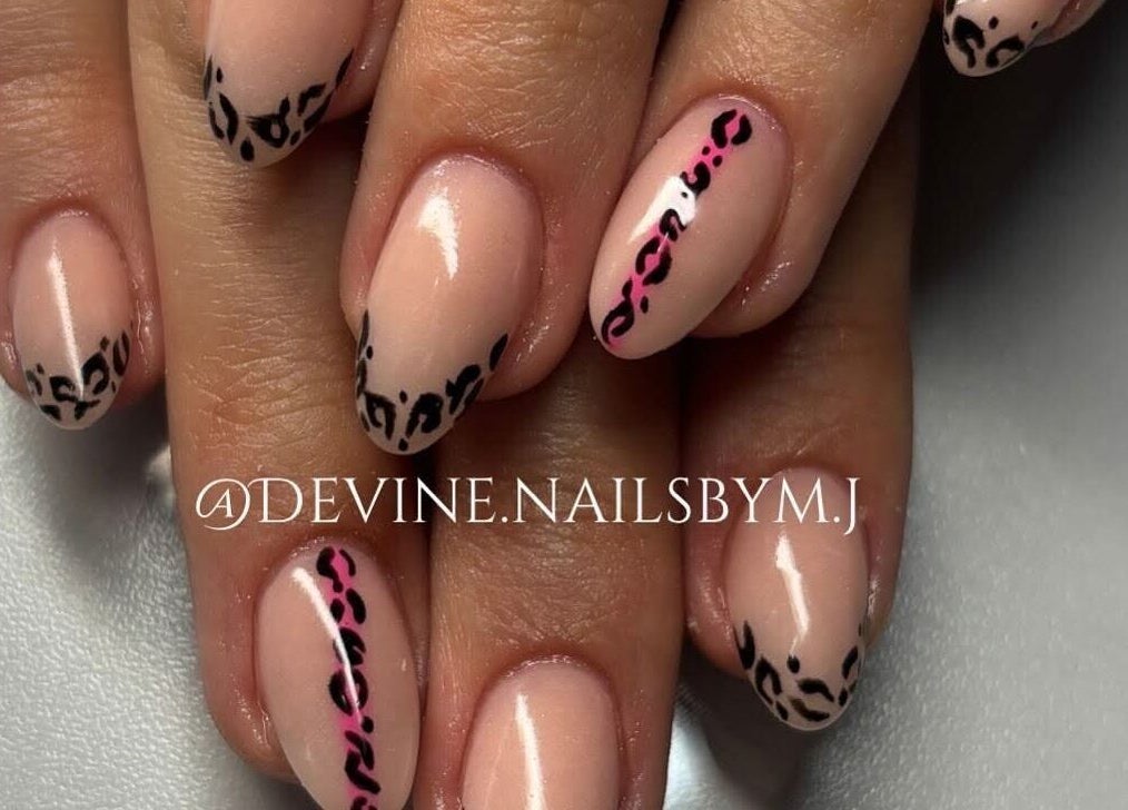 Elegant leopard-print nail art at Devine Nails by M J, Pretoria, Gauteng, ZA. Perfect blend of style and sophistication.