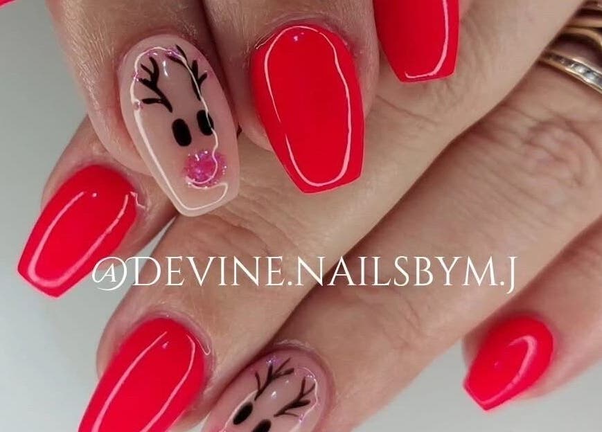 Bright red nails with reindeer art by Devine Nails by M J, Pretoria, Gauteng, ZA.