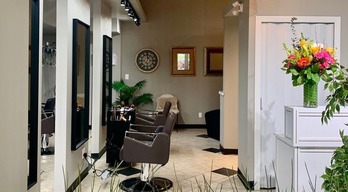 Interior of The SOOM Hair Studio in Coquitlam, British Columbia, CA featuring stylish chairs and vibrant decor.