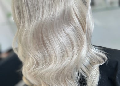 Silky blonde hair waves styled at SLS Hair and Beauty, Chessington, England, GB.