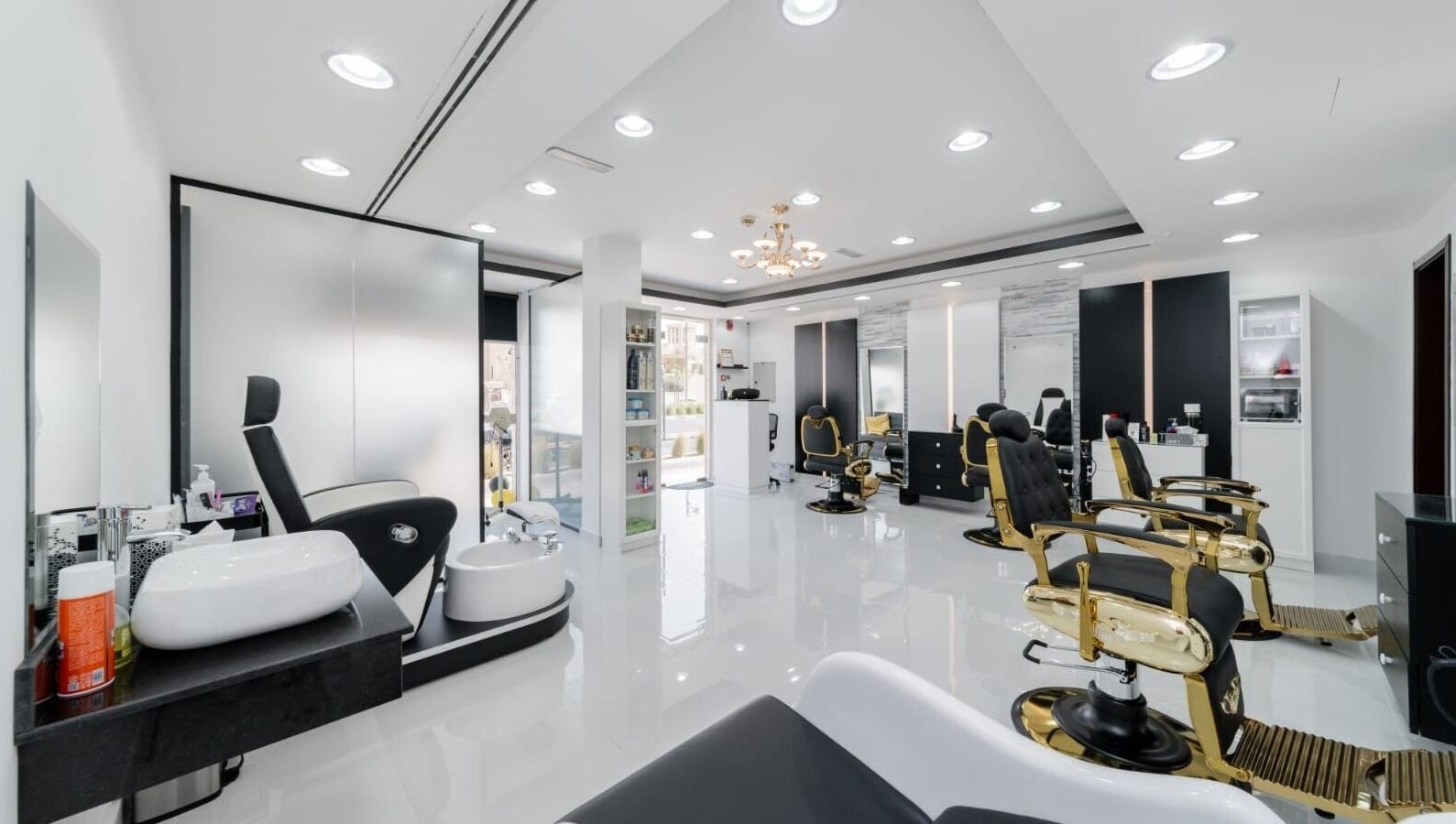 Sophisticated interior of Kenchie Gents Salon - Jumeirah in Dubai, Dubai, AE with luxurious barber chairs.