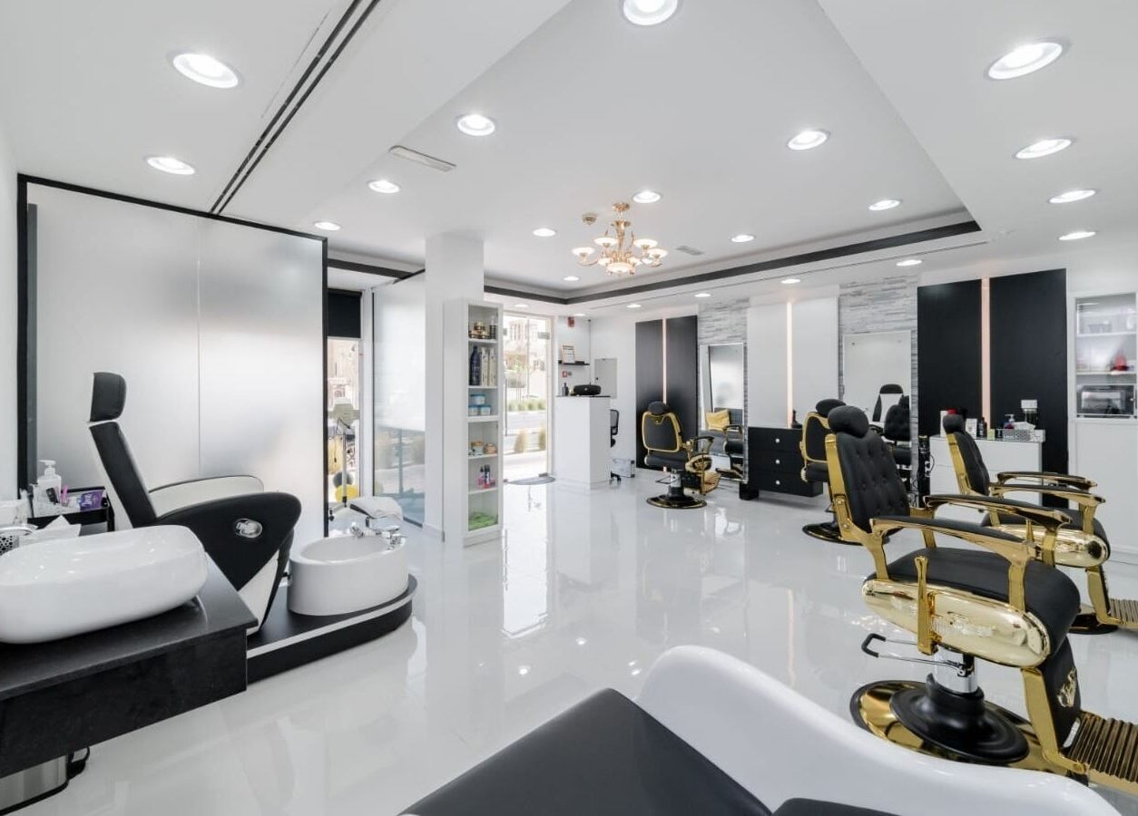 Sophisticated interior of Kenchie Gents Salon - Jumeirah in Dubai, Dubai, AE with luxurious barber chairs.