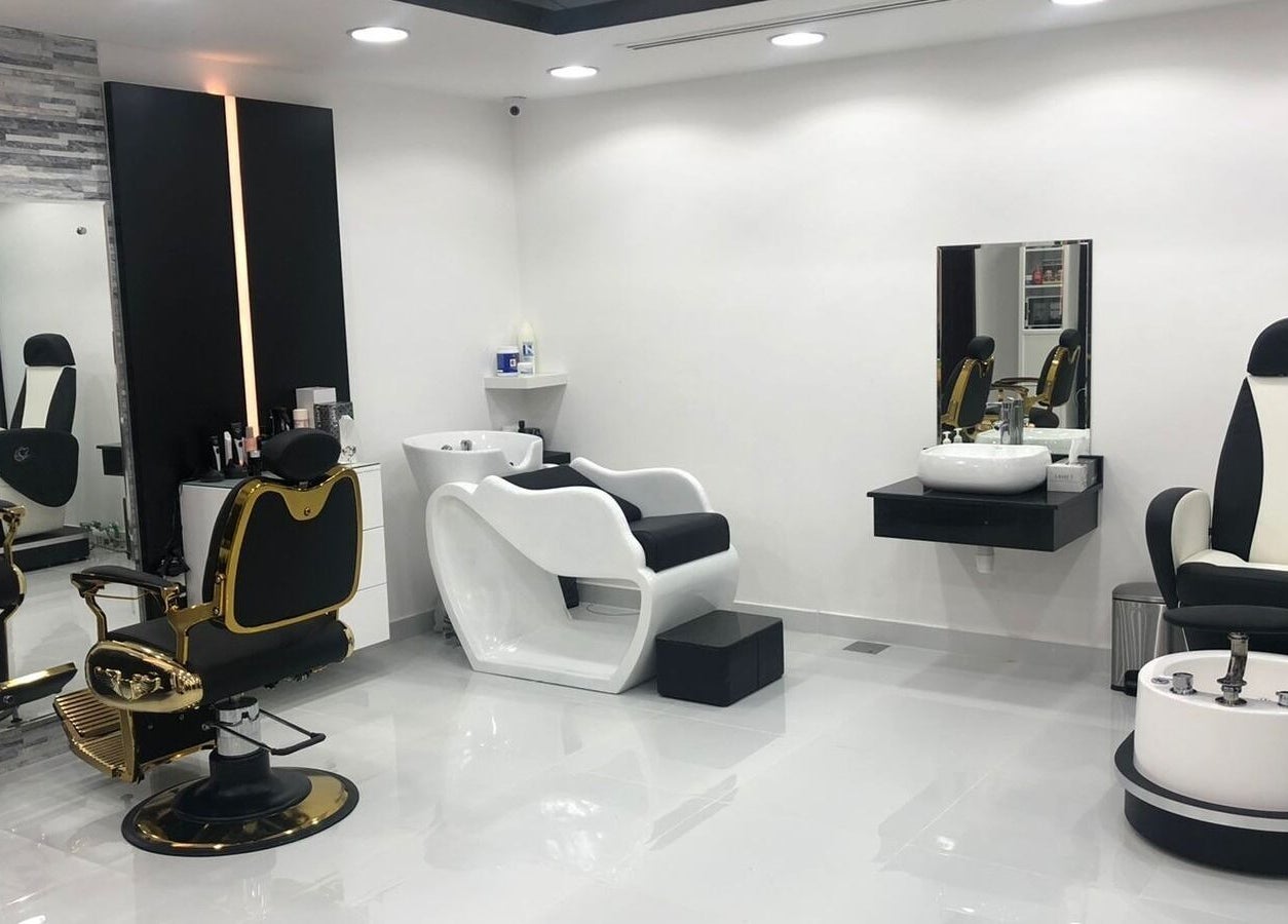 Elegant grooming chairs at Kenchie Gents Salon - Jumeirah in Dubai, Dubai, AE, showcasing modern, sleek salon design.