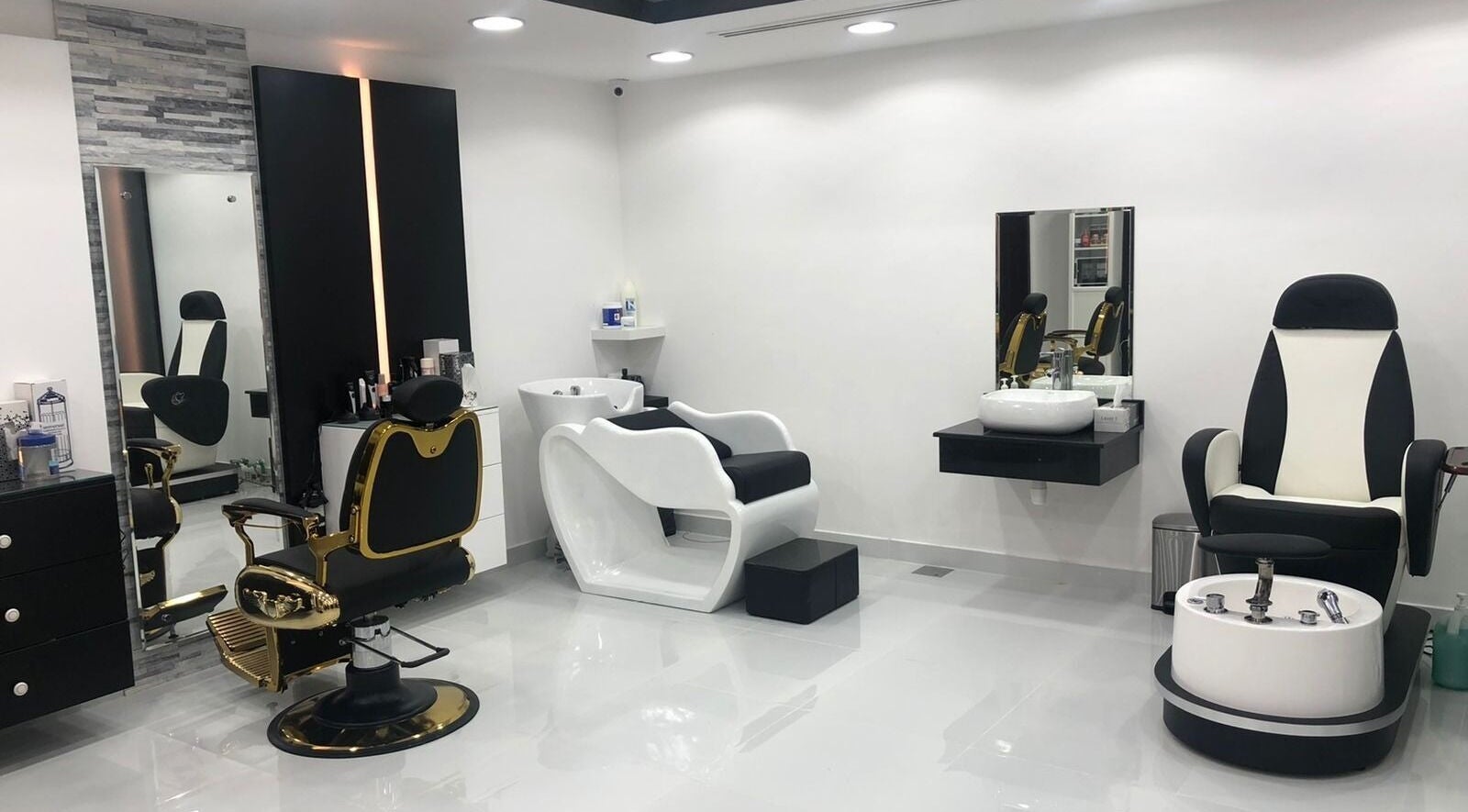 Elegant grooming chairs at Kenchie Gents Salon - Jumeirah in Dubai, Dubai, AE, showcasing modern, sleek salon design.