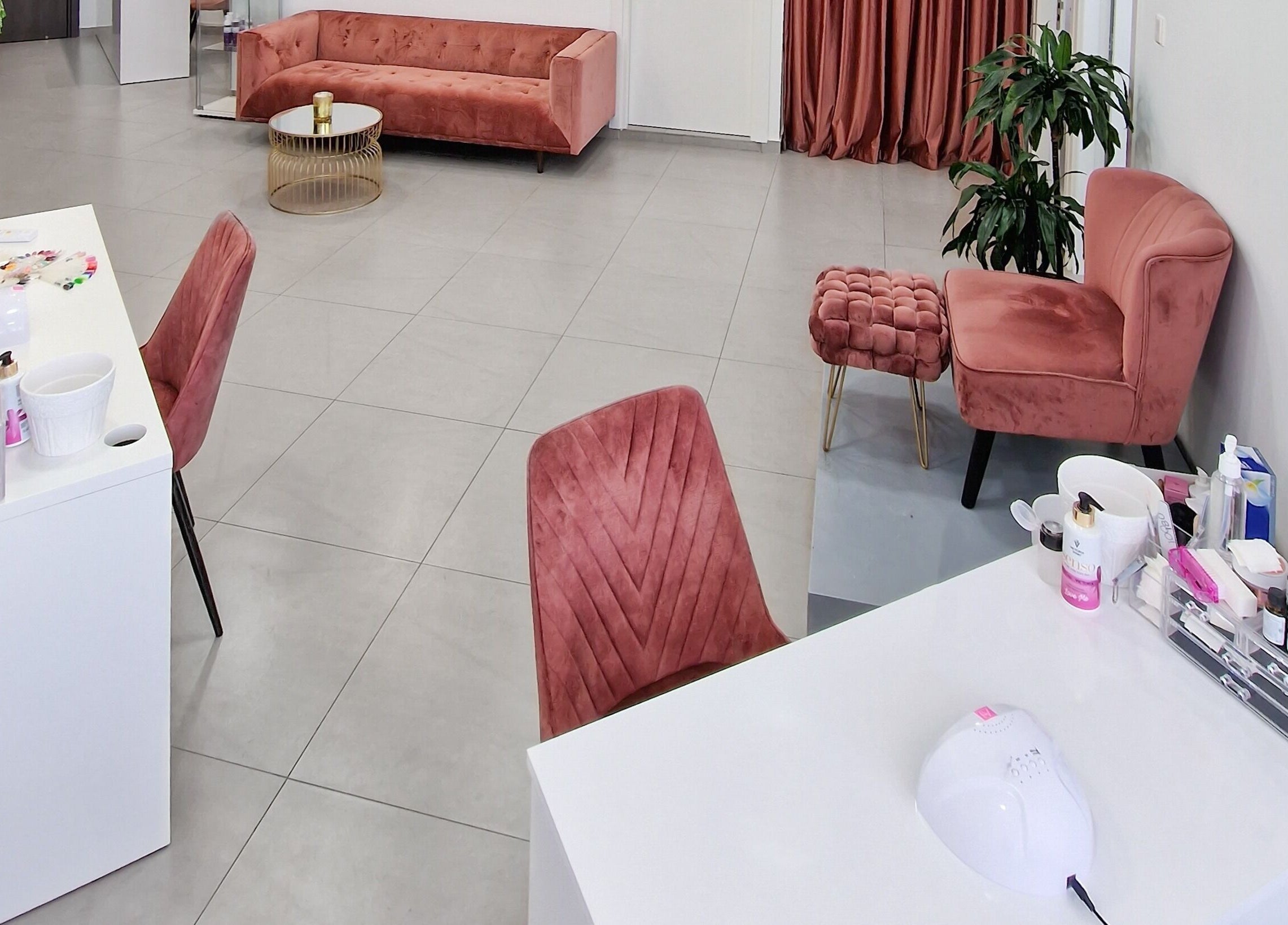 Elegant salon interior at Nathal Lakatamia, Lakatamia, Nicosia, CY with plush pink seating and modern décor.