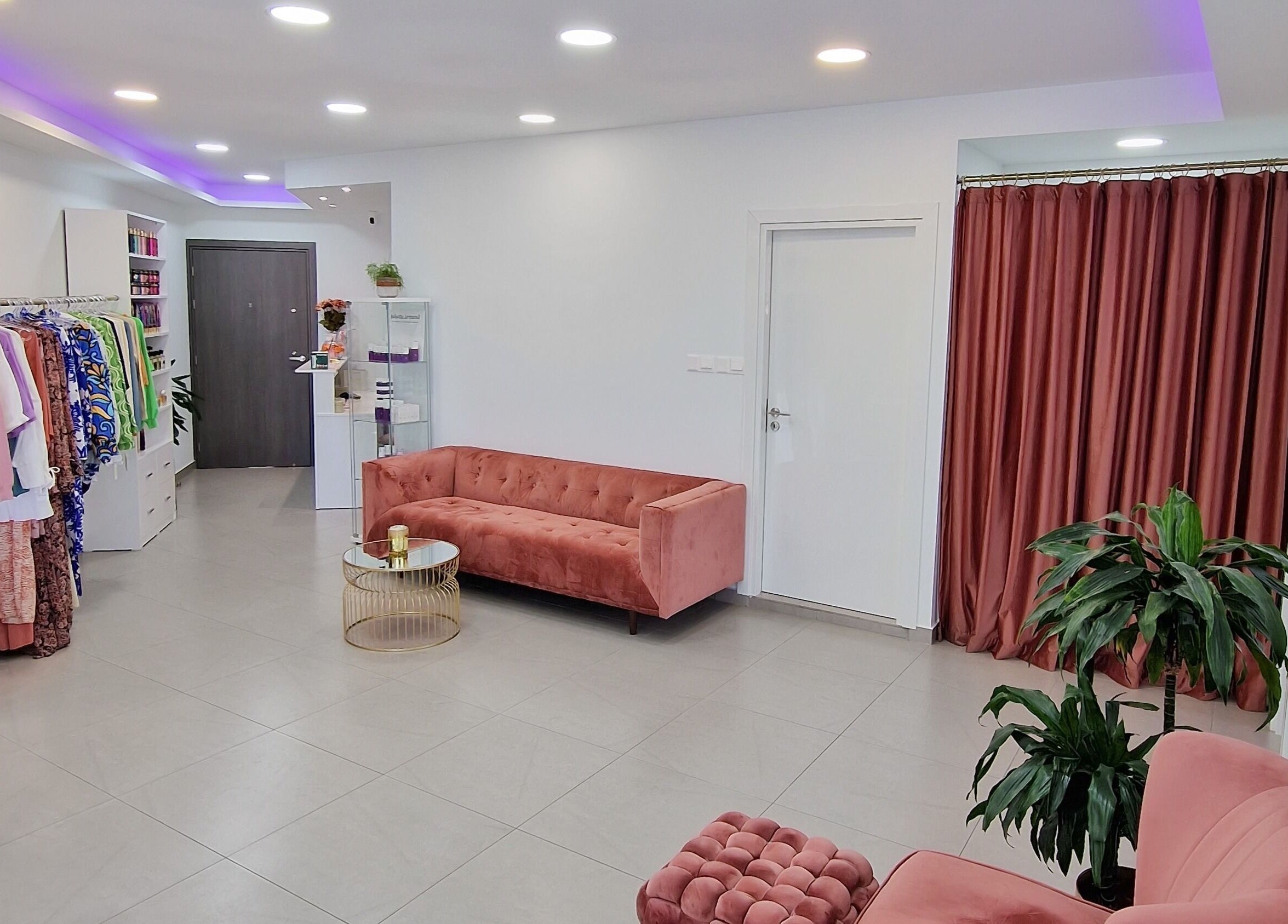 Elegant interior at Nathal Lakatamia, Lakatamia, Nicosia, CY featuring stylish seating and fashion displays.