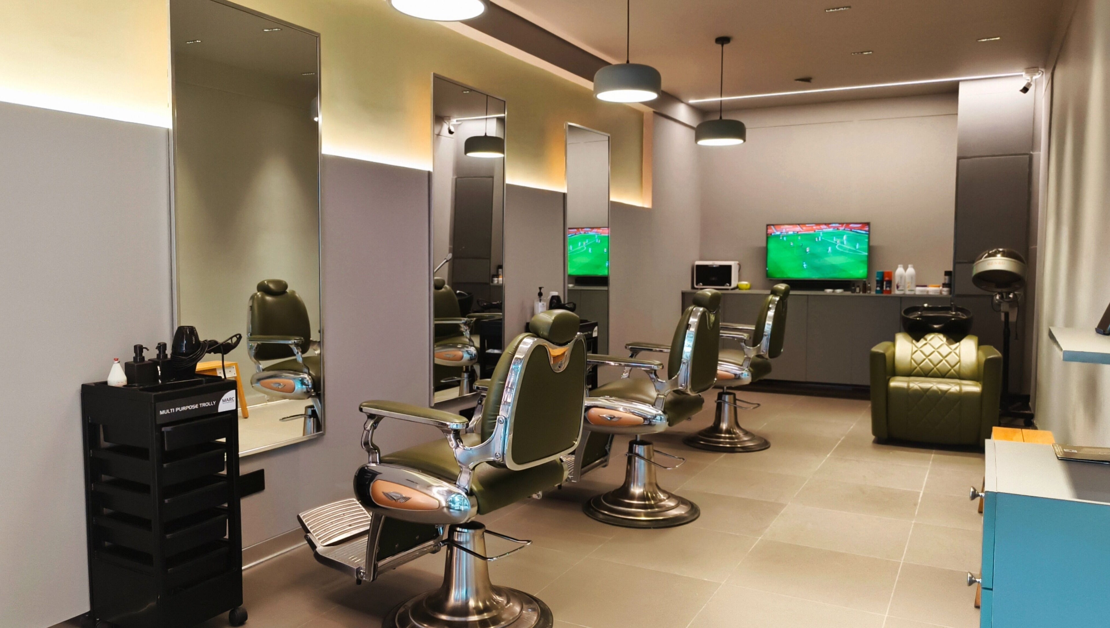 Stylish interior of BarberCo - Banashankari, Bengaluru, Karnataka, IN featuring modern barber chairs and mirrors.