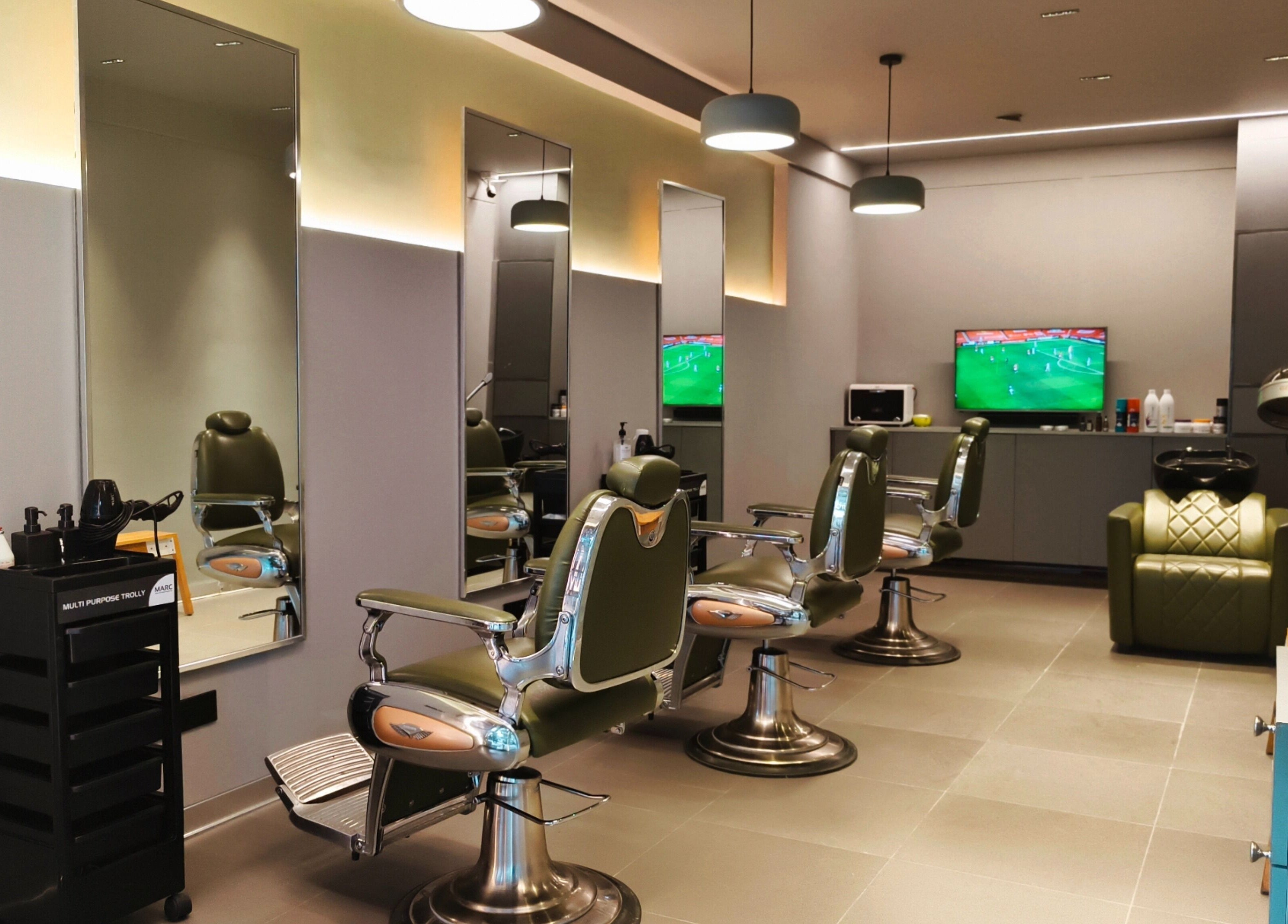 Stylish interior of BarberCo - Banashankari, Bengaluru, Karnataka, IN featuring modern barber chairs and mirrors.