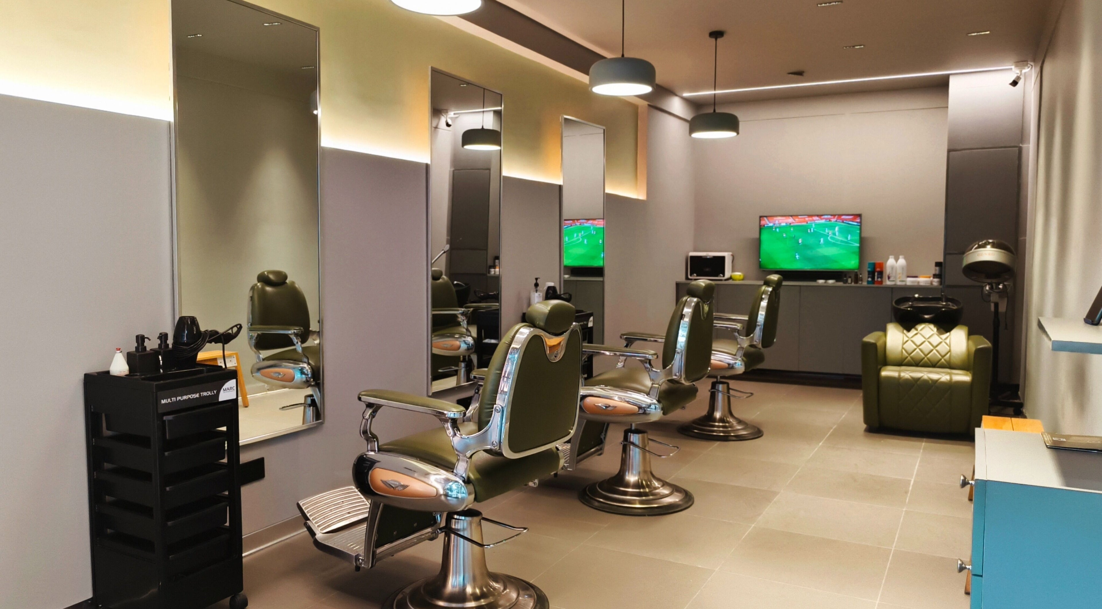 Stylish interior of BarberCo - Banashankari, Bengaluru, Karnataka, IN featuring modern barber chairs and mirrors.