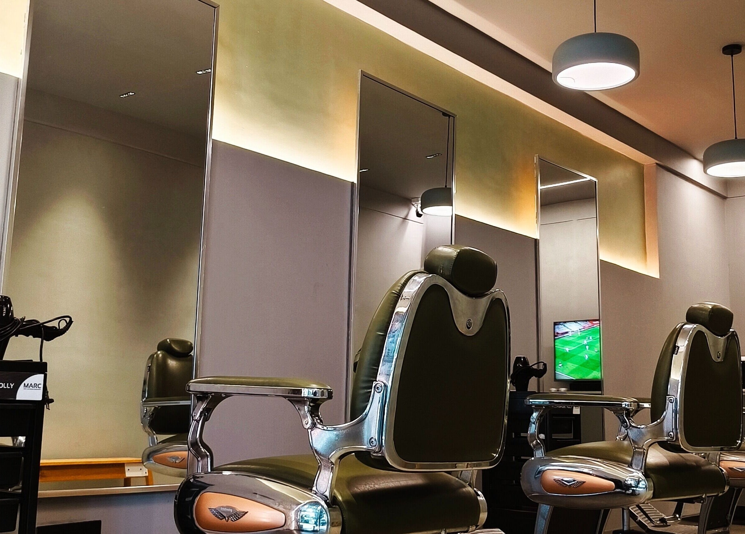 Modern barber chairs at BarberCo - Banashankari, Bengaluru, Karnataka, IN. Stylish and comfortable interior.