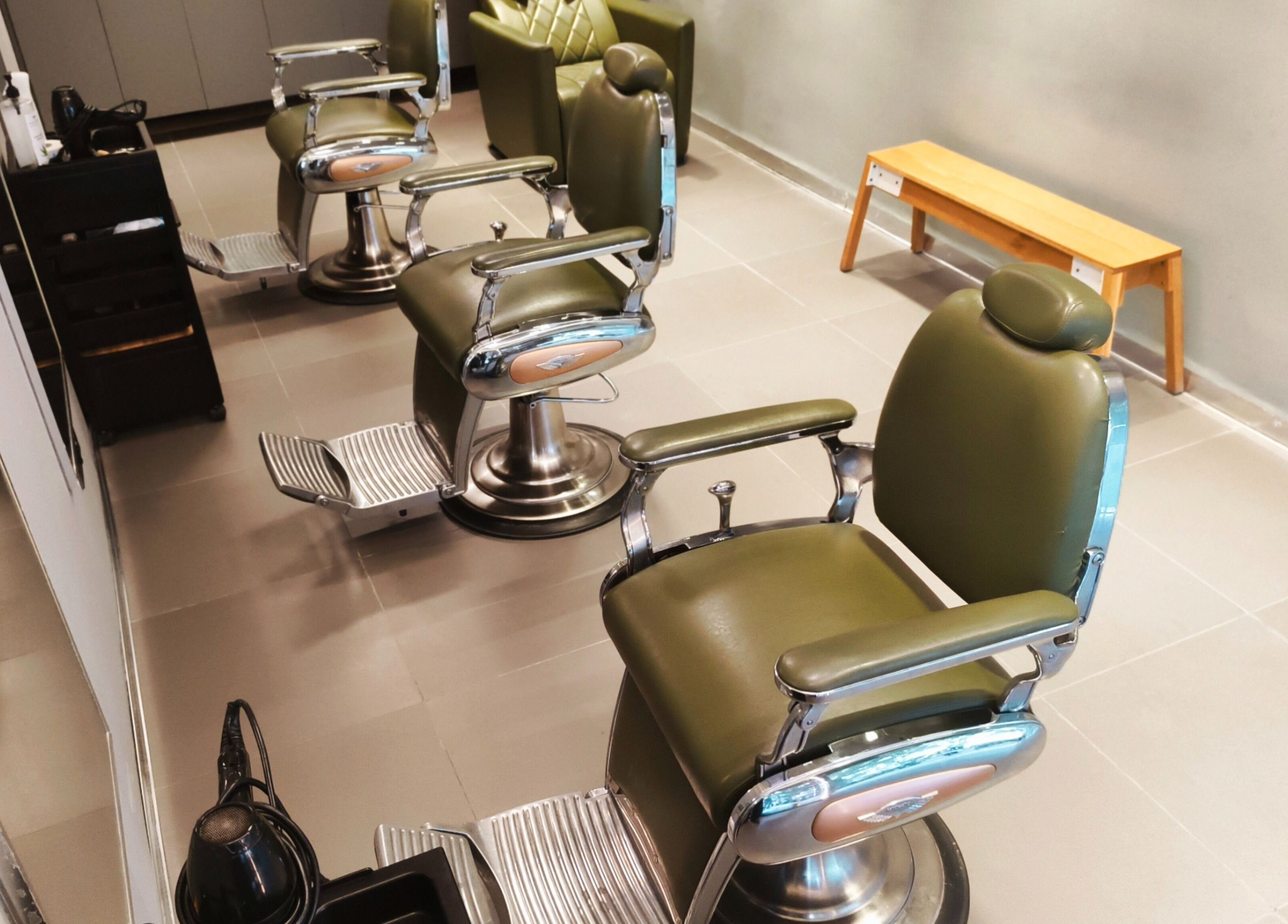 Modern barber chairs at BarberCo - Banashankari, Bengaluru, Karnataka, IN, showcasing premium styling services.