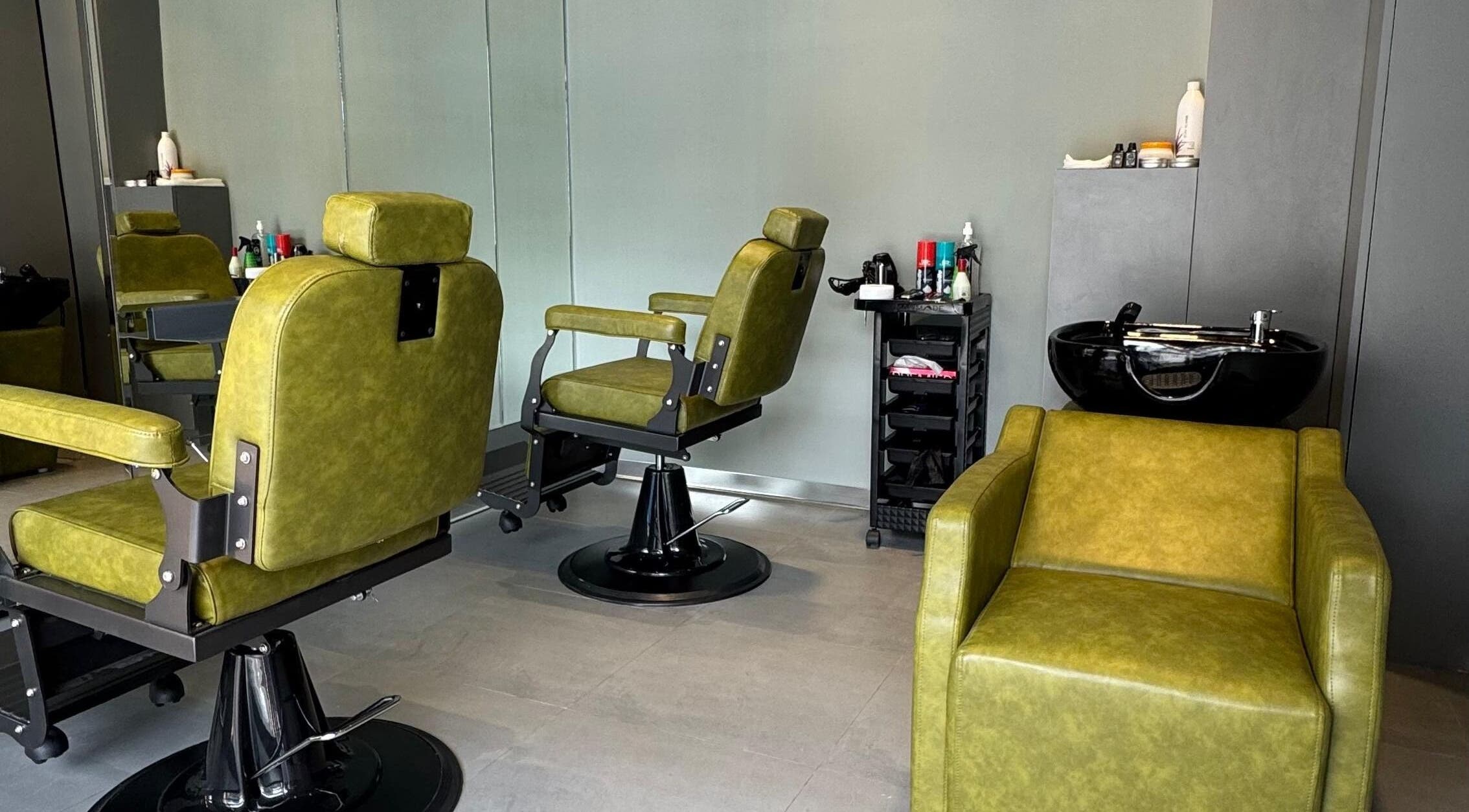 Stylish green barber chairs at BarberCo - Frazer Town, Bangalore, Karnataka, IN, enhancing a sleek modern interior.