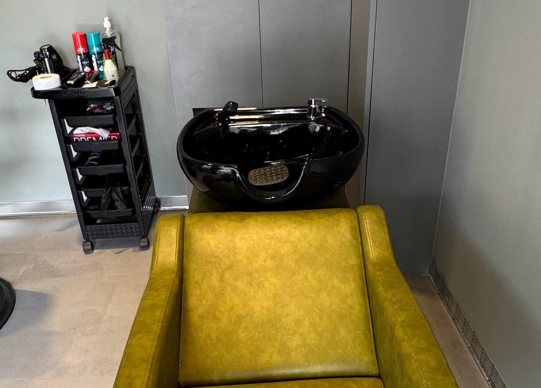 BarberCo - Frazer Town salon wash station in Bangalore, Karnataka, IN with sleek sink and styling tools.