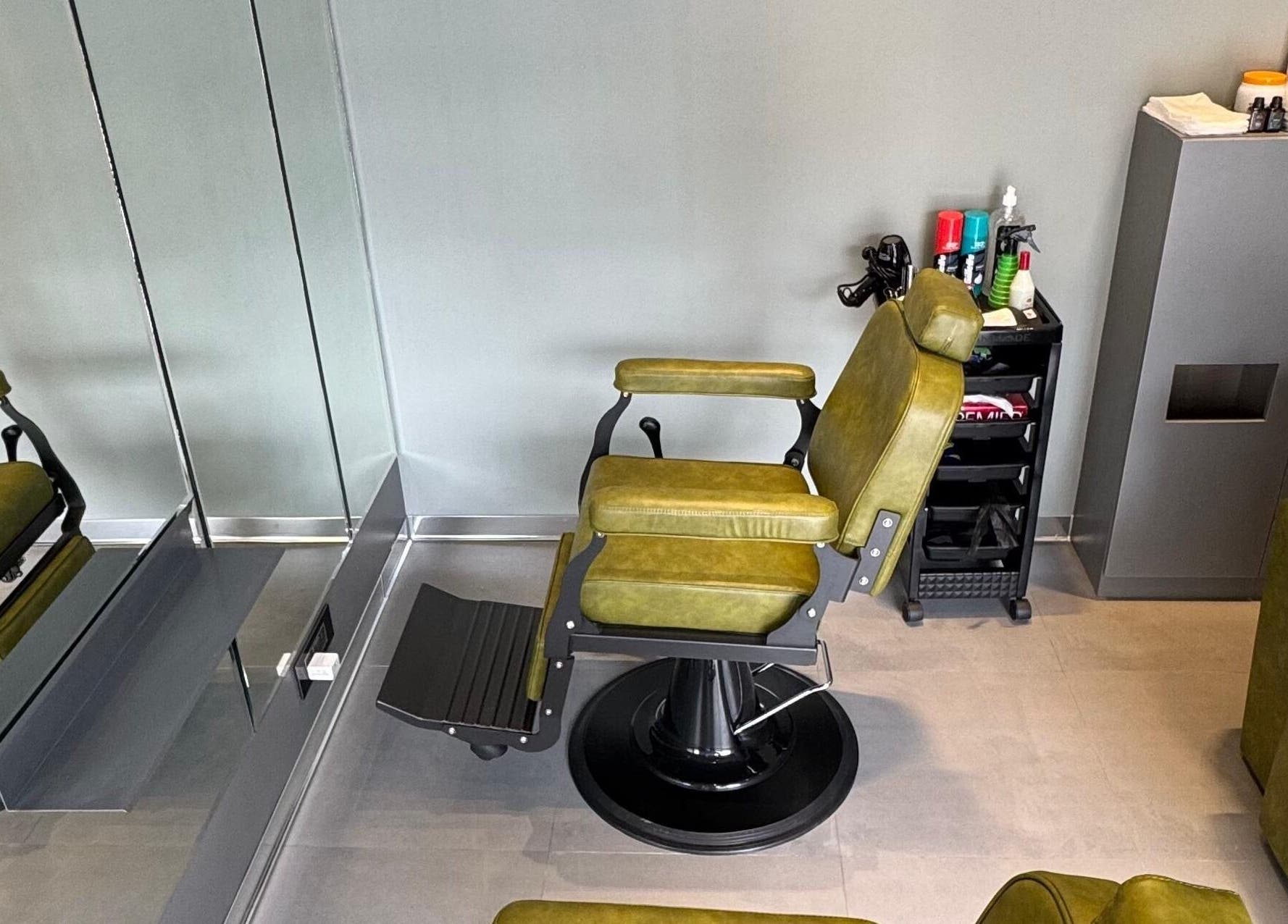 Modern barber chair at BarberCo - Frazer Town, Bangalore, Karnataka, IN, ready for grooming services.