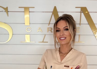 Professional at Sian Carrie Studio in Chelmsford, England, GB, posing with a friendly smile.