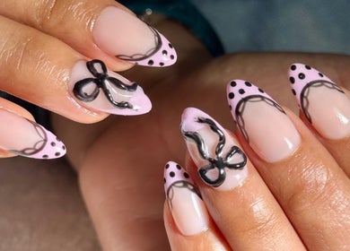 Elegant nail art with black lace design at Elysian Beauty Spa & Ladies Salon, Muscat, Muscat Governorate, OM.