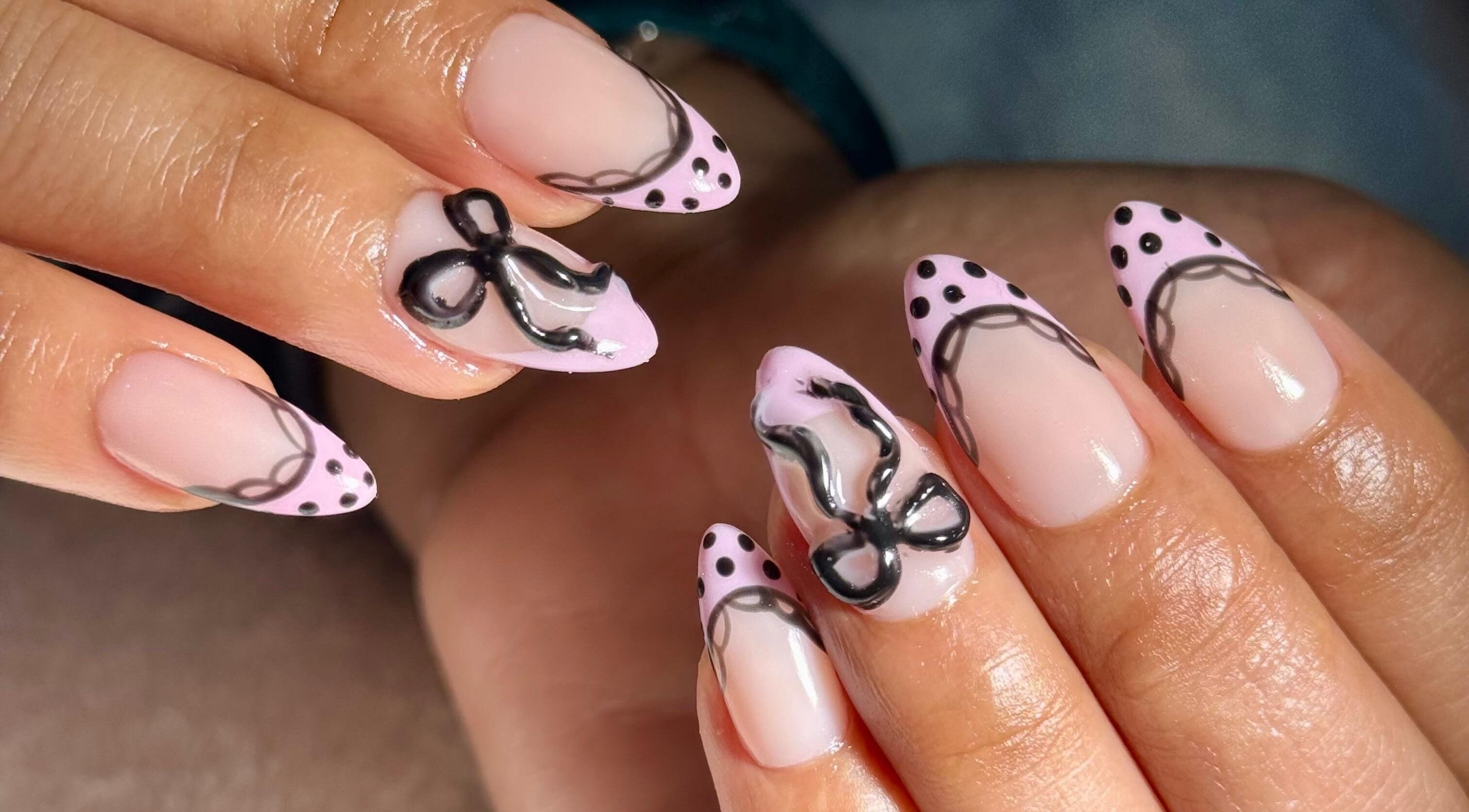 Elegant nail art with black lace design at Elysian Beauty Spa & Ladies Salon, Muscat, Muscat Governorate, OM.