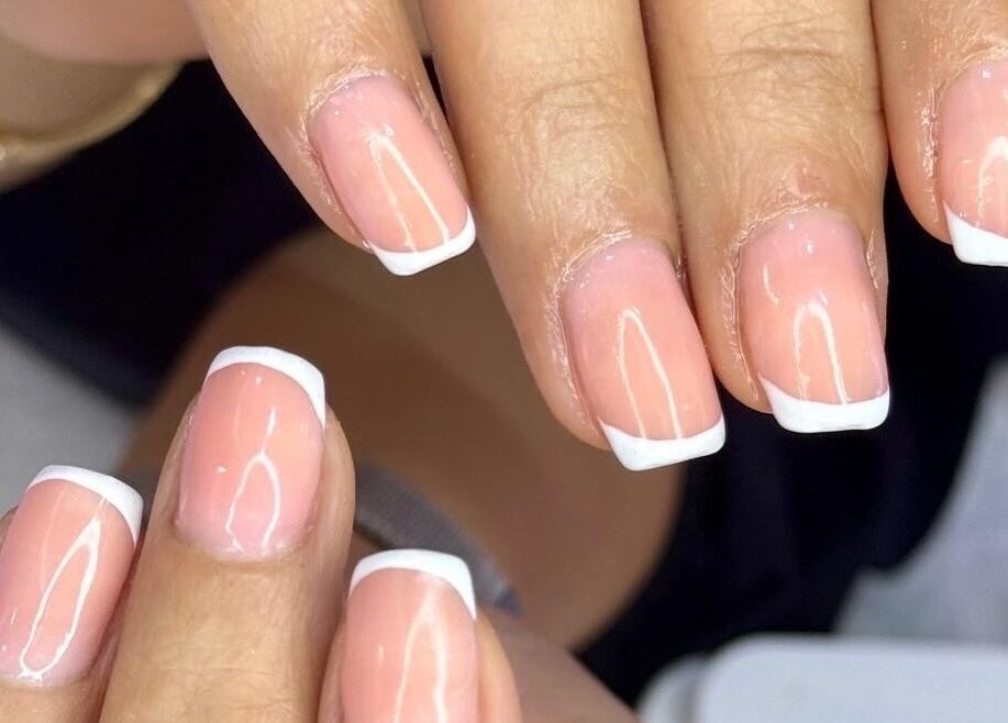 French manicure at Elysian Beauty Spa & Ladies Salon, Muscat, OM. Perfect nails for a polished look.