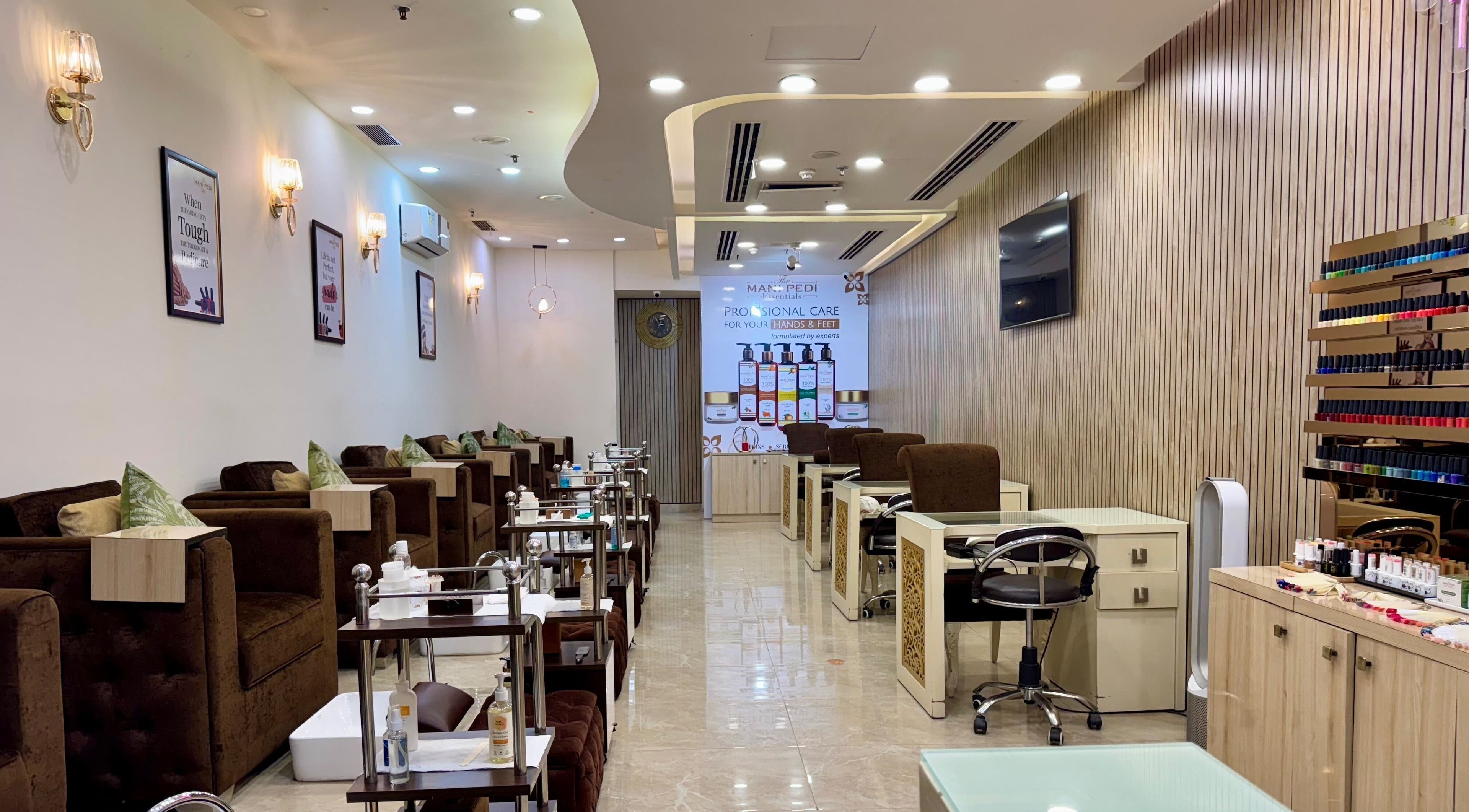 Luxurious interior of The Mani Pedi Spa - Sohna Road in Gurugram, Haryana, IN with plush seating and nail care stations.