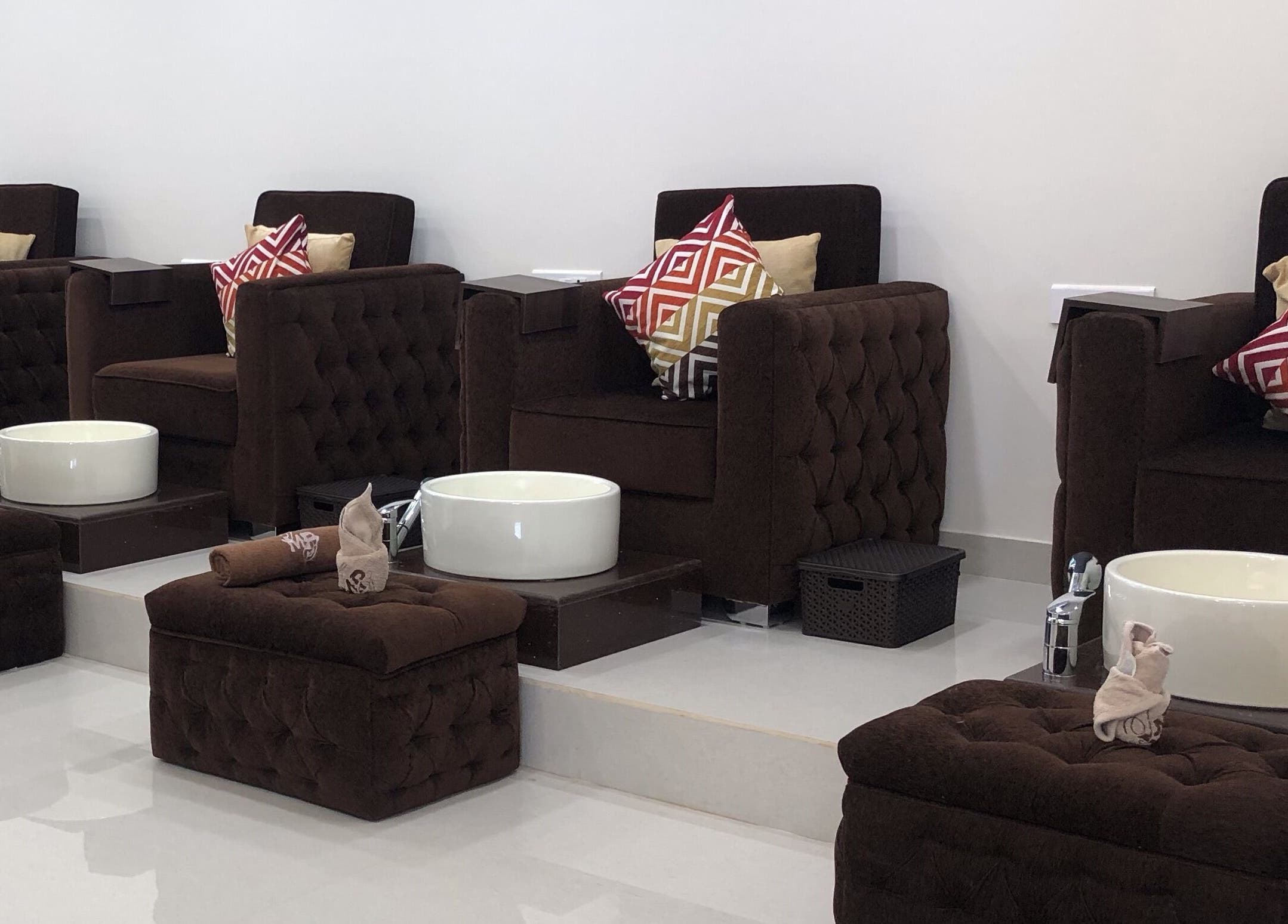 Luxurious pedicure chairs at The Mani Pedi Spa, Galleria Market, DLF 4, Gurugram, Haryana, IN, offering comfort.