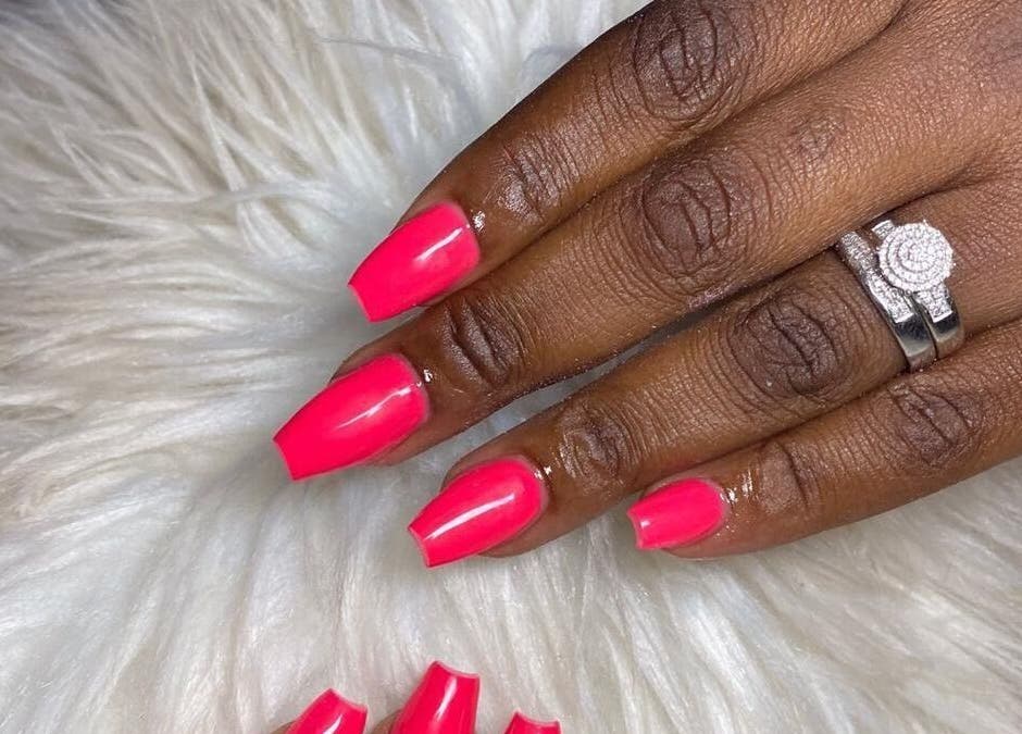 Vibrant pink manicure at Narenda's Beauty Lounge, Bridgetown, Saint Michael, BB. Enhancing elegance and style.