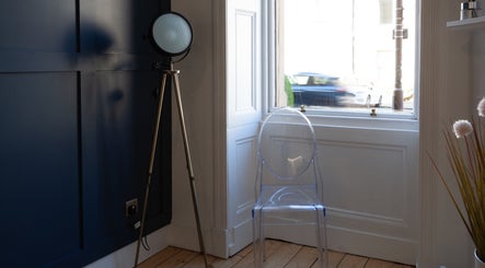 Stylish corner at Soul Therapy Wellbeing with a modern chair and lamp in Edinburgh, Scotland, GB.