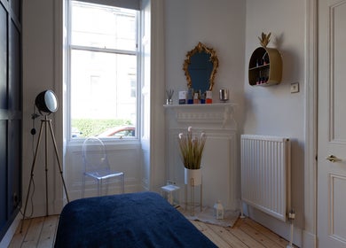 Elegant therapy room at Soul Therapy Wellbeing, Edinburgh, Scotland. Features chic decor and soft lighting.