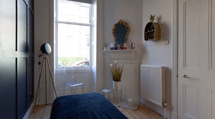 Elegant therapy room at Soul Therapy Wellbeing, Edinburgh, Scotland. Features chic decor and soft lighting.