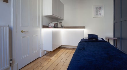 Relaxing room interior at Soul Therapy Wellbeing, Edinburgh, Scotland, GB, featuring a comfortable treatment bed.
