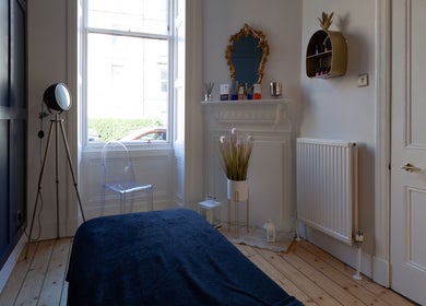 Relaxing room at Soul Therapy Wellbeing, Edinburgh, Scotland, GB. Features modern decor and cozy ambiance.