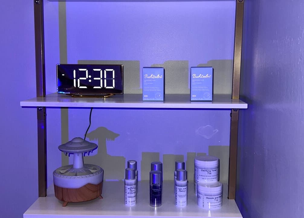 Skincare products on a shelf at Elixir Skyn, Nassau, New Providence, BS, highlighting a calming wellness ambiance.
