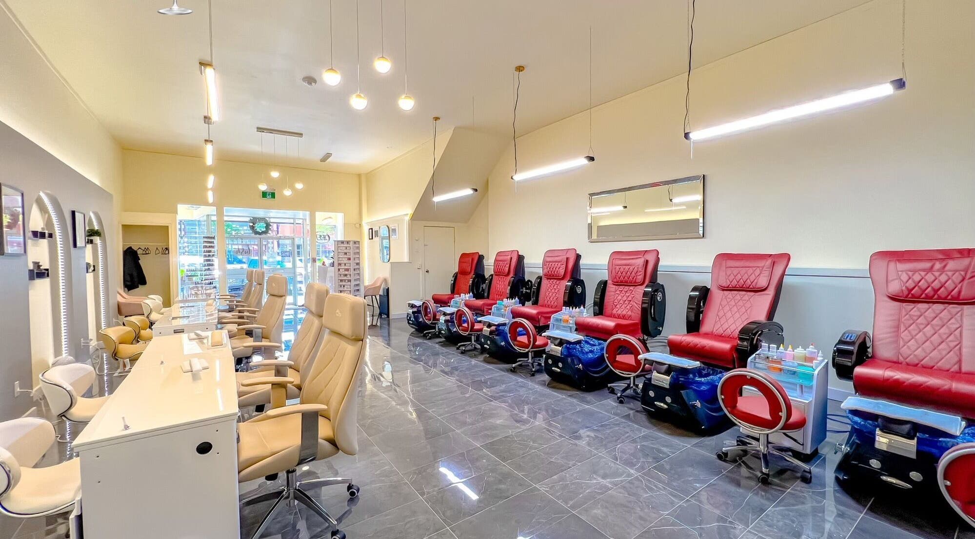 Interior of Solitude Nails Salon in Saskatoon, Saskatchewan, CA with plush pedicure chairs.