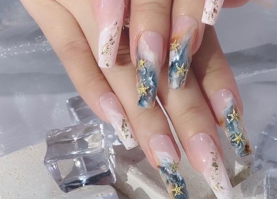 Elegant starry nail art at Solitude Nails Salon, Saskatoon, Saskatchewan, CA. Perfect for stylish celebrations.