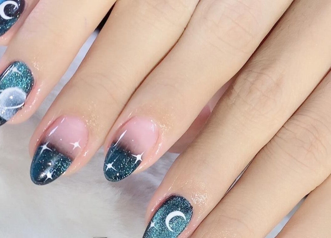 Stylish celestial-themed nail art at Solitude Nails Salon, Saskatoon, Saskatchewan, CA.