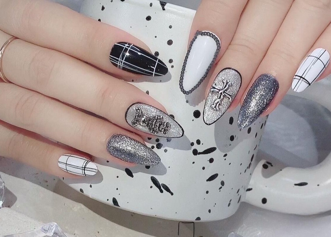 Stylish black and silver nail design at Solitude Nails Salon, Saskatoon, Saskatchewan, CA.