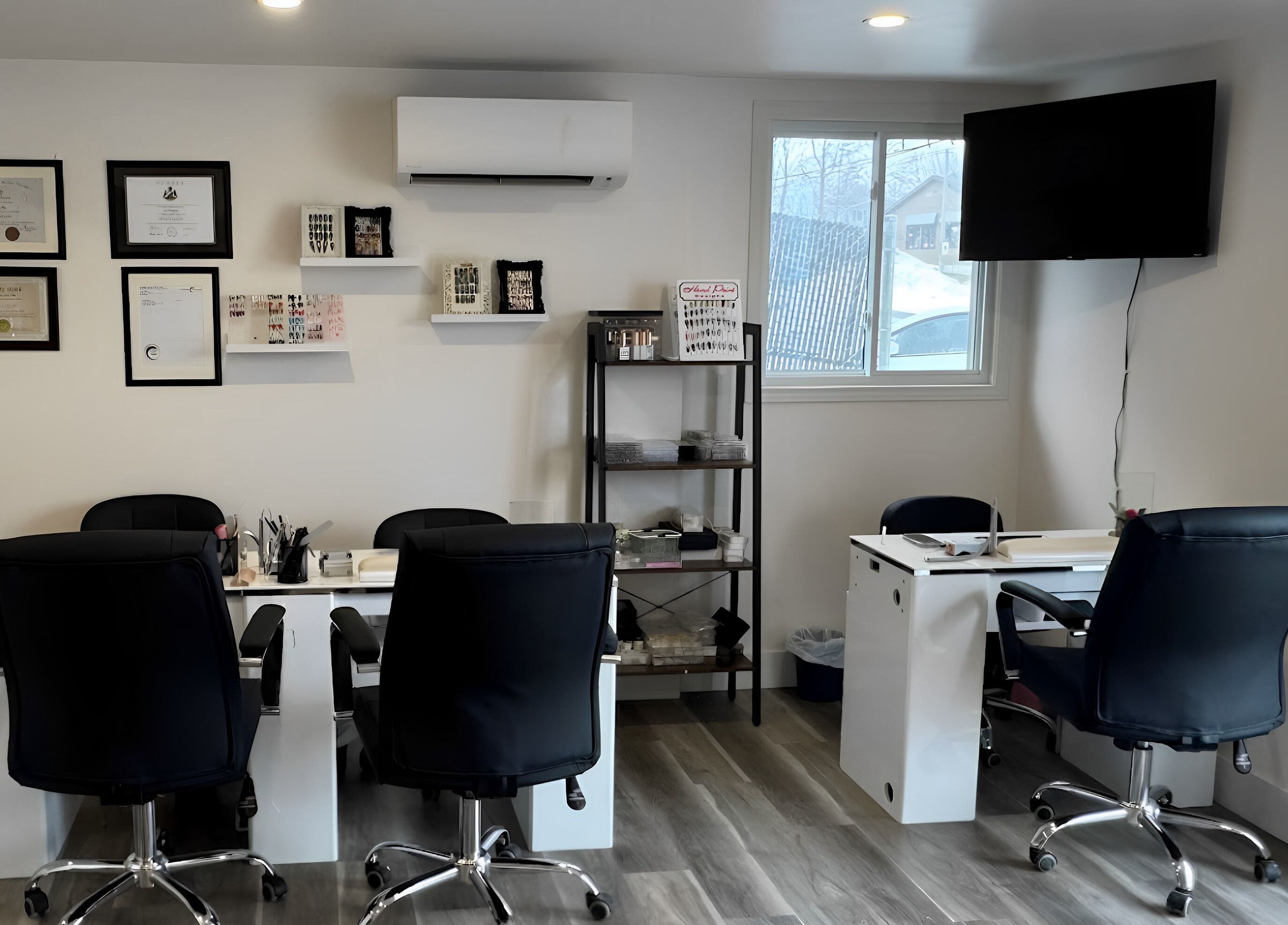Manicure station at Solitude Spa Rothesay in Rothesay, New Brunswick, CA with modern decor and comfortable seating.