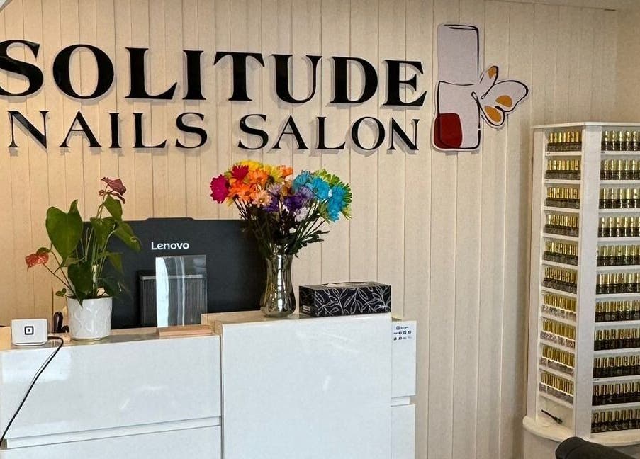 Reception area at Solitude Spa Rothesay in Rothesay, New Brunswick, CA featuring a nail polish display.