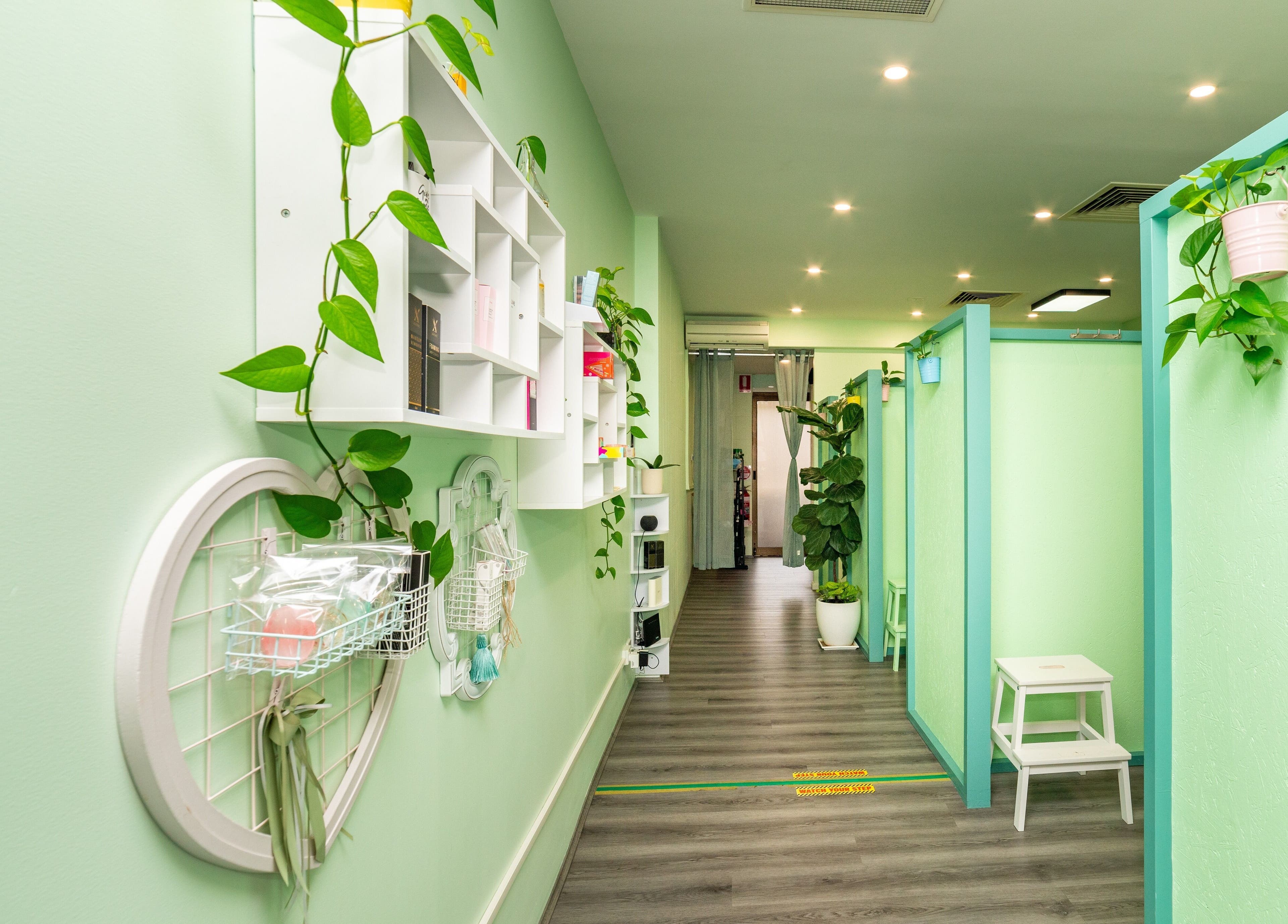 Choi Lash and Brow hallway with green walls and plants, Lane Cove, New South Wales, AU.