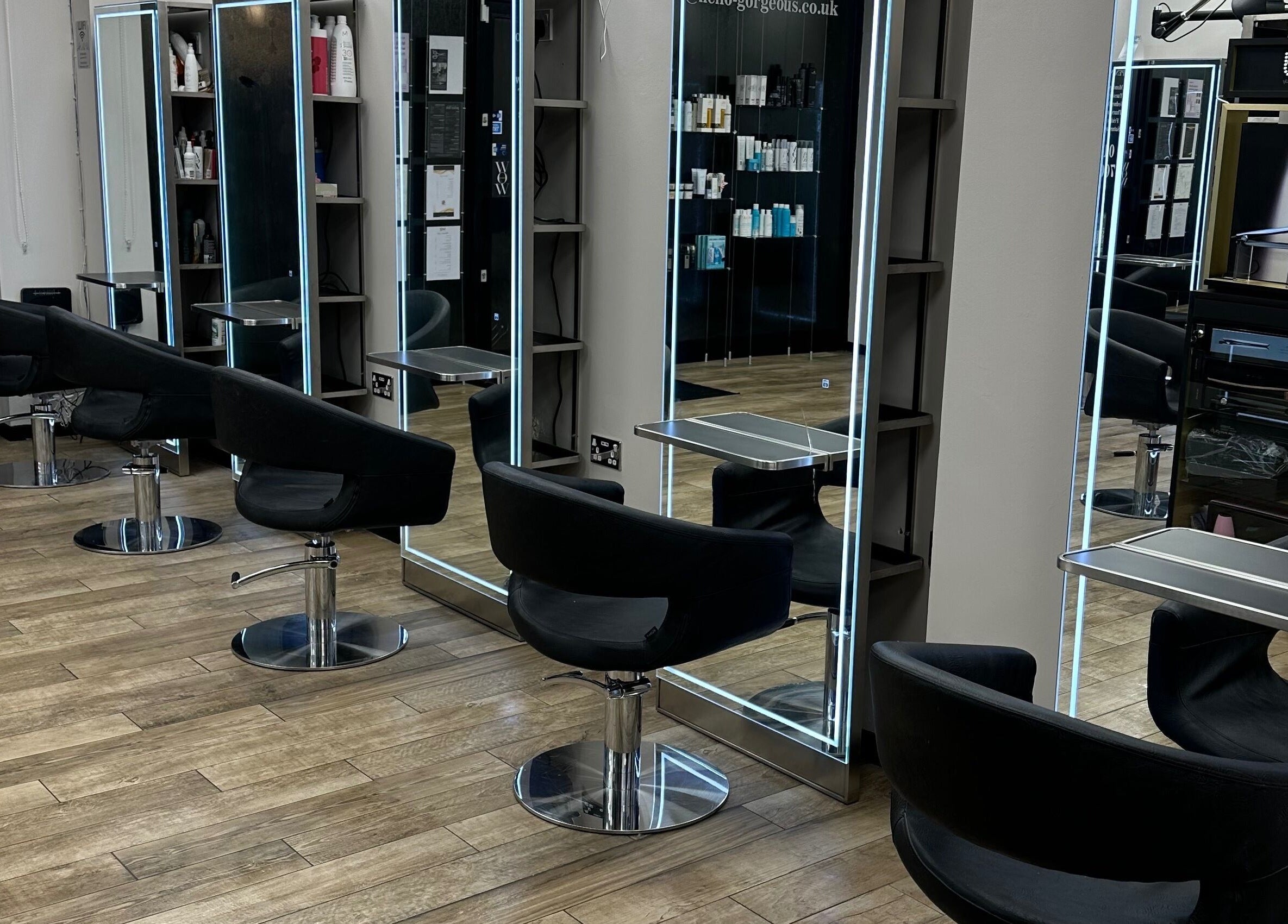 Modern salon setup with sleek black chairs at Gorgeous Swindon, Blunsdon Saint Andrew, England, GB.
