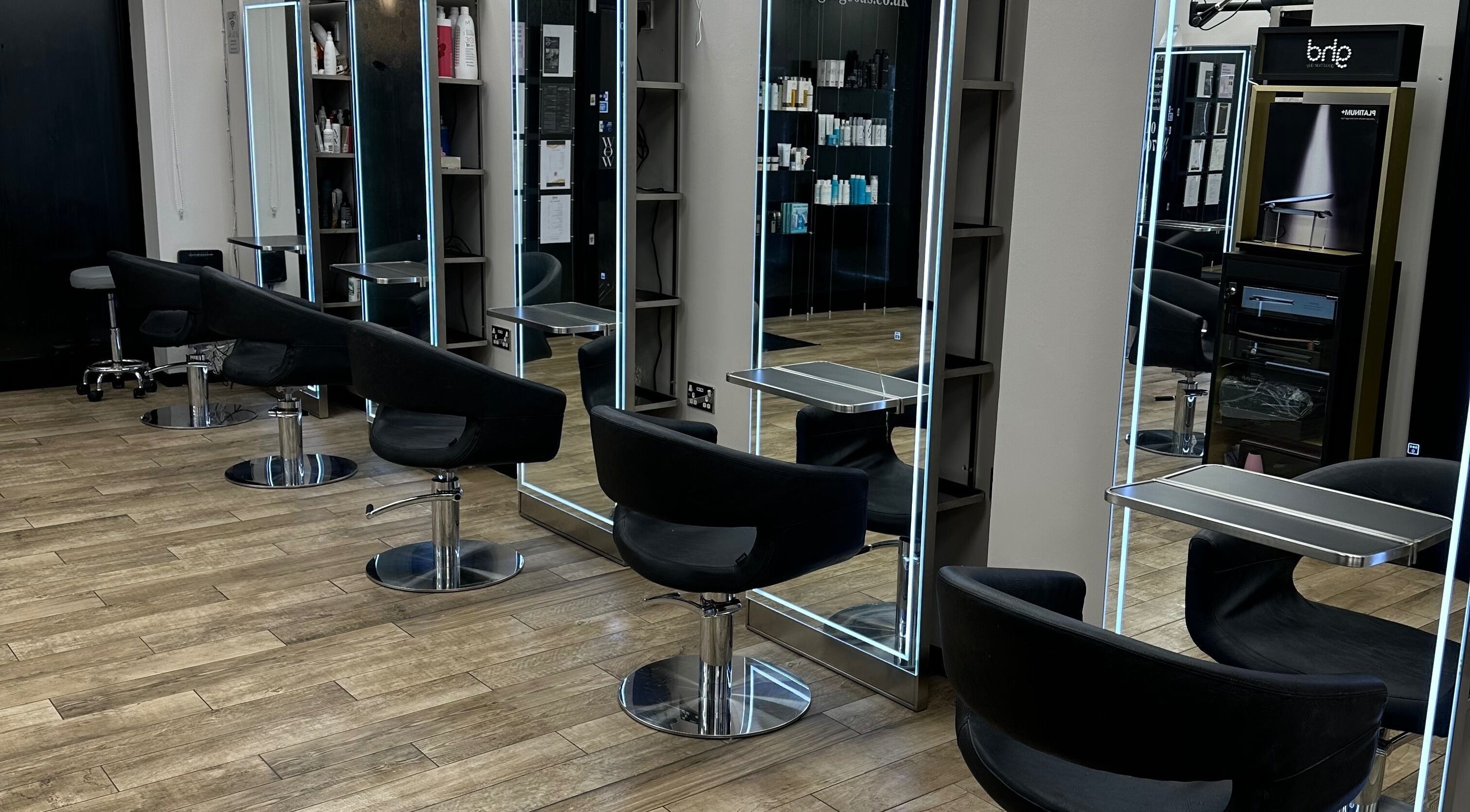 Modern salon setup with sleek black chairs at Gorgeous Swindon, Blunsdon Saint Andrew, England, GB.
